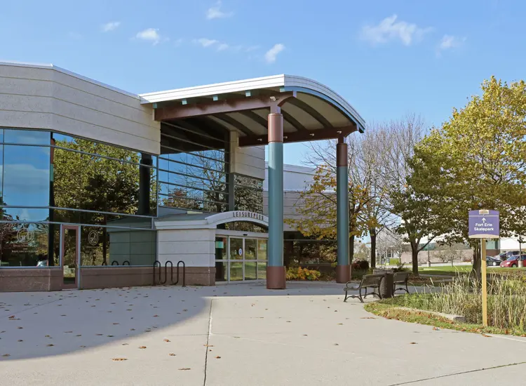 A large arena entrance in the fall