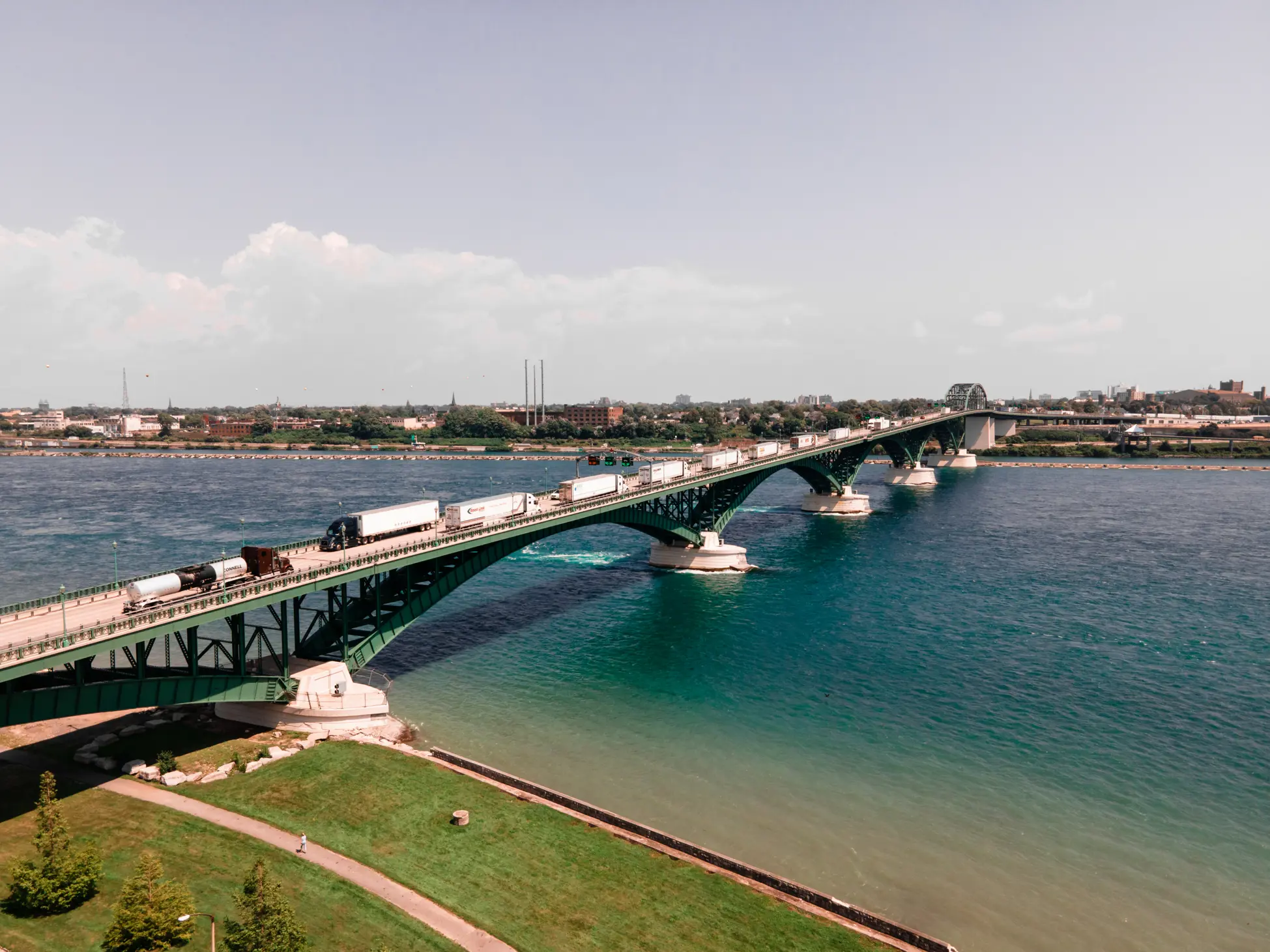 A giant bridge crosses a large river
