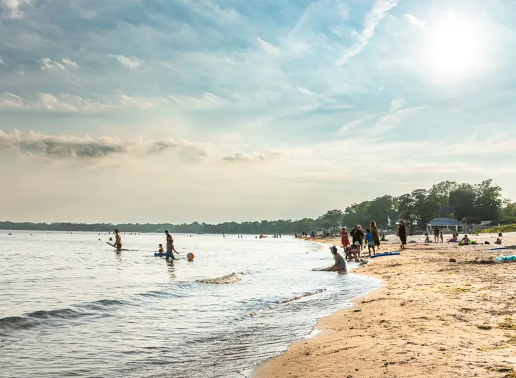 People relaxing playing and relaxing on a beach