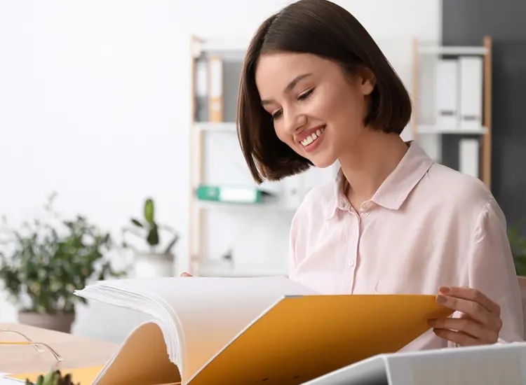 A woman checks documents
