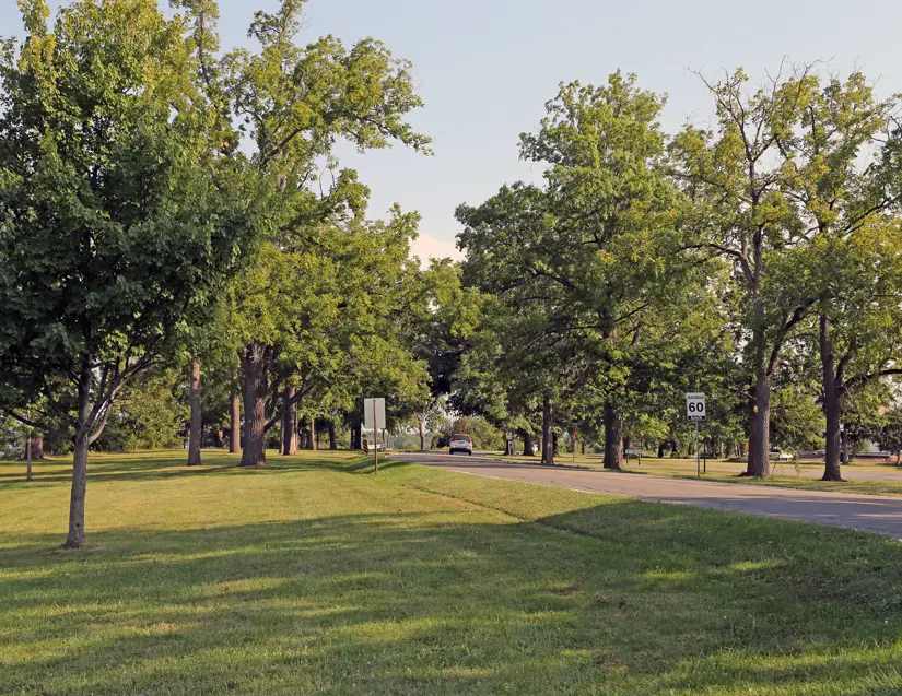 A road that runs along the Niagara River with a single car on it