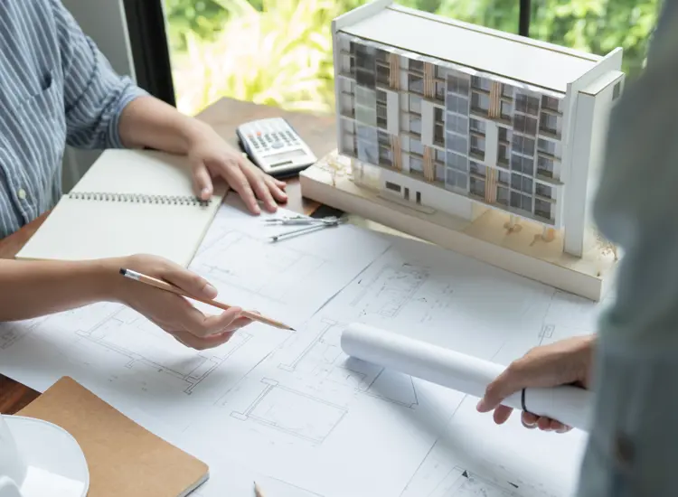 People work on building plans