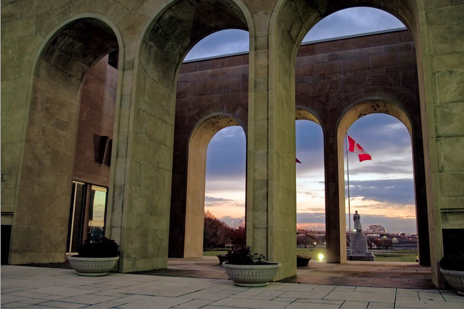 A large arch statue with a statue